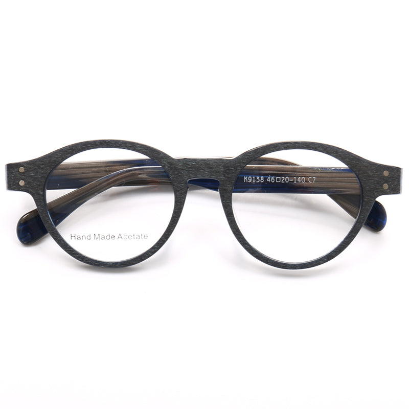 A pair of blue and grey round acetate eyeglass frames