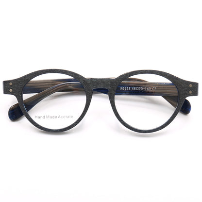 A pair of blue and grey round acetate eyeglass frames