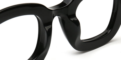Close-up of a black eyeglasses frame on a white background