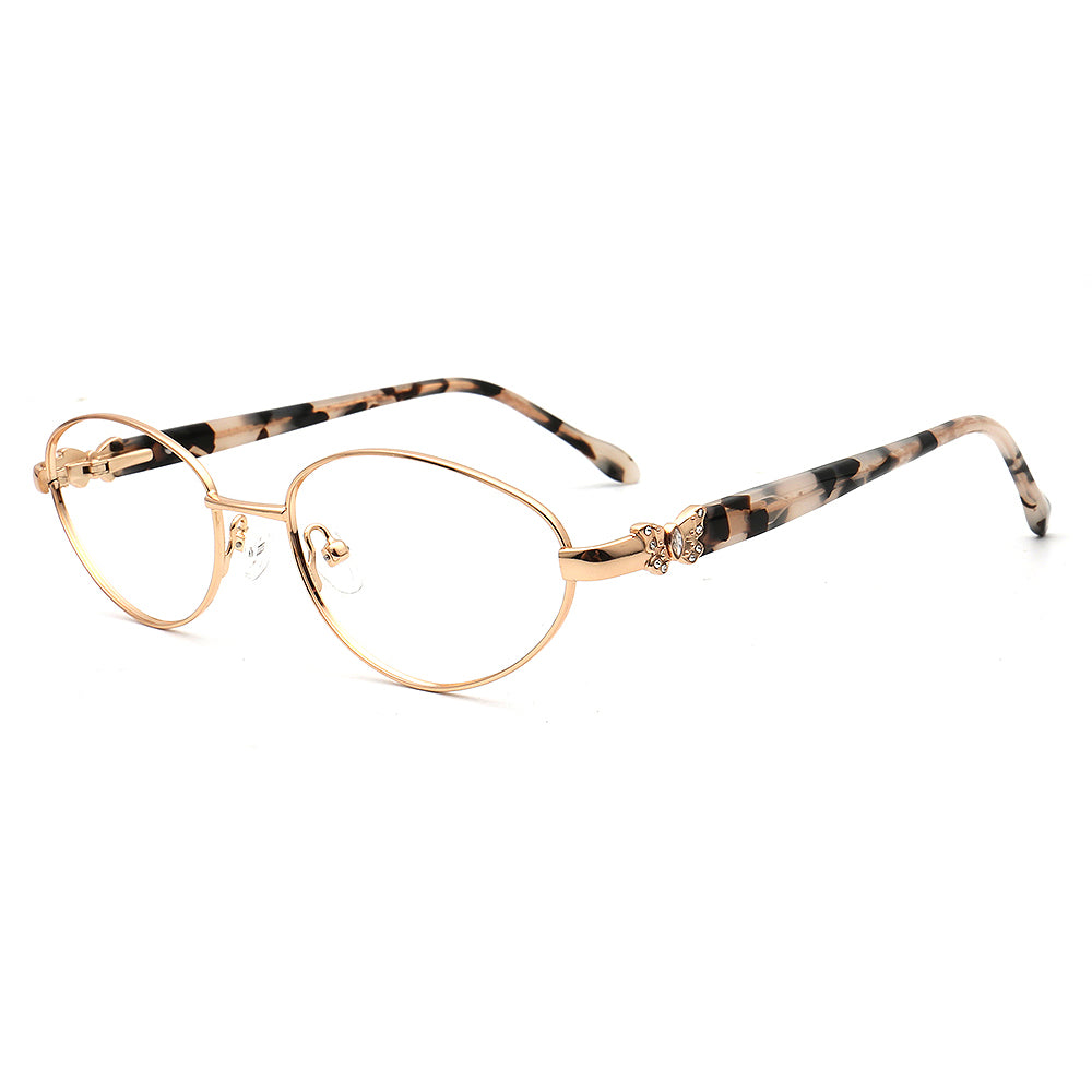 Eyeglasses with gold frame and tortoiseshell arms on a white background