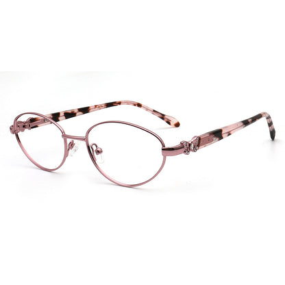 Pink Oval eyewear frames with a decorative butterfly temple on a white background