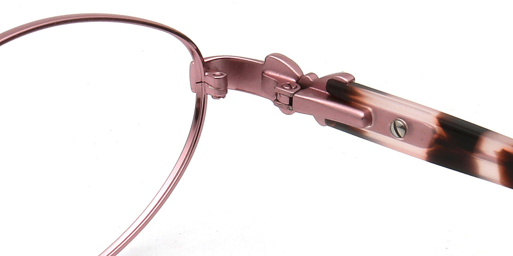 Close-up of a pair of glasses with a rose pink frame and tortoiseshell accents on a white background.
