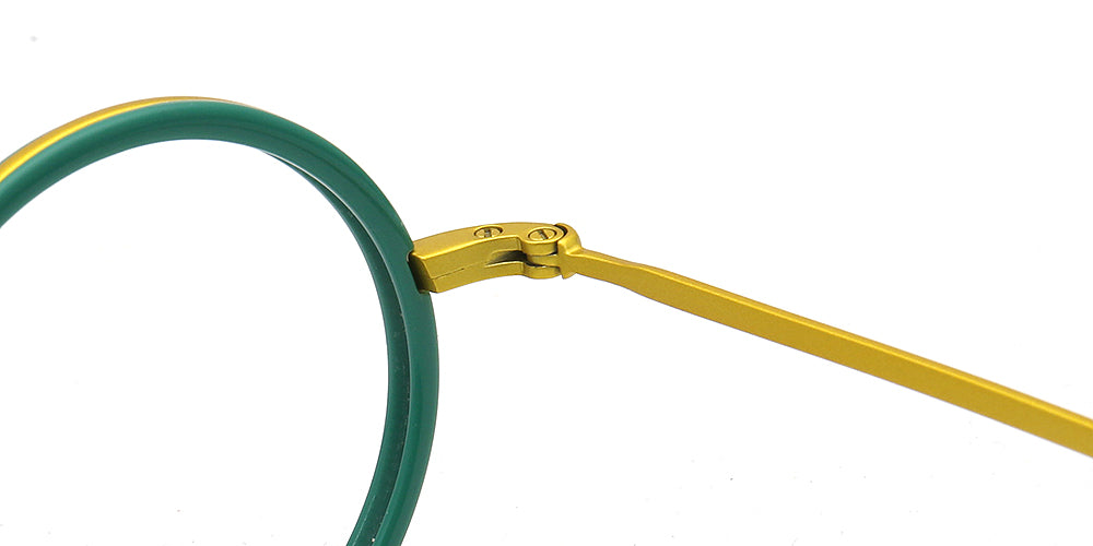 Close-up of eyeglasses with green frame and gold temple tips on a white background