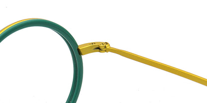 Close-up of eyeglasses with green frame and gold temple tips on a white background