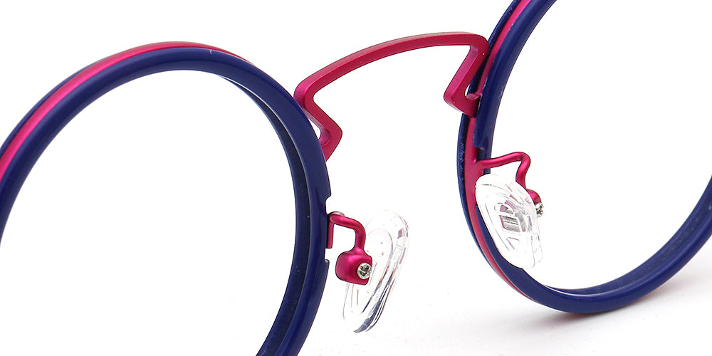 Close-up of a pair of blue and pink eyeglasses on a white background