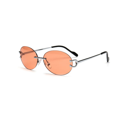 Y2K orange tinted round rimless sunglasses with silver temples