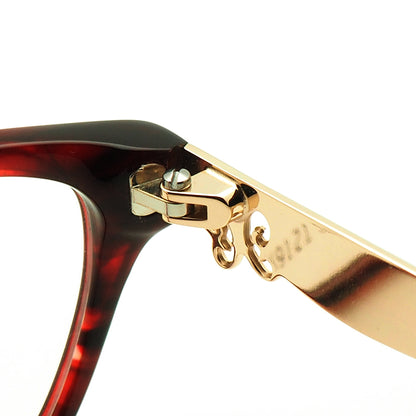 Metal hinge of red patterned eyeglasses for women