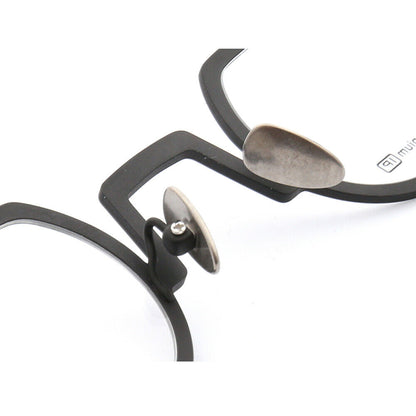Nose pads of black shield shaped titanium glasses
