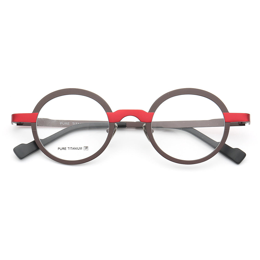 A pair of red and black round titanium glasses