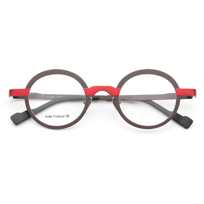 A pair of red and black round titanium glasses