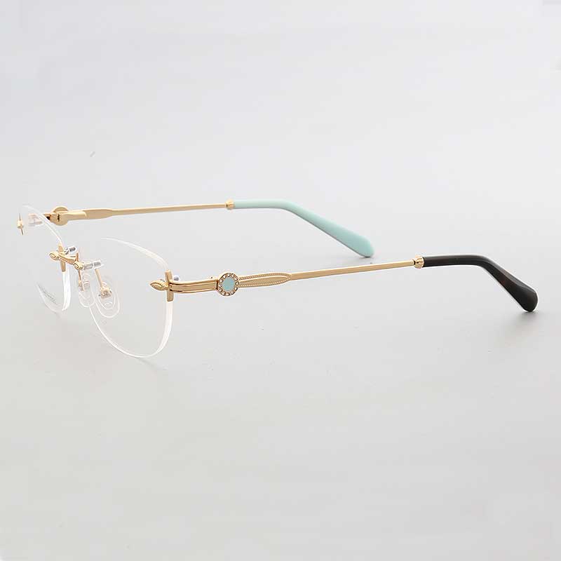 Side view of gold and teal oval rimless eyeglasses