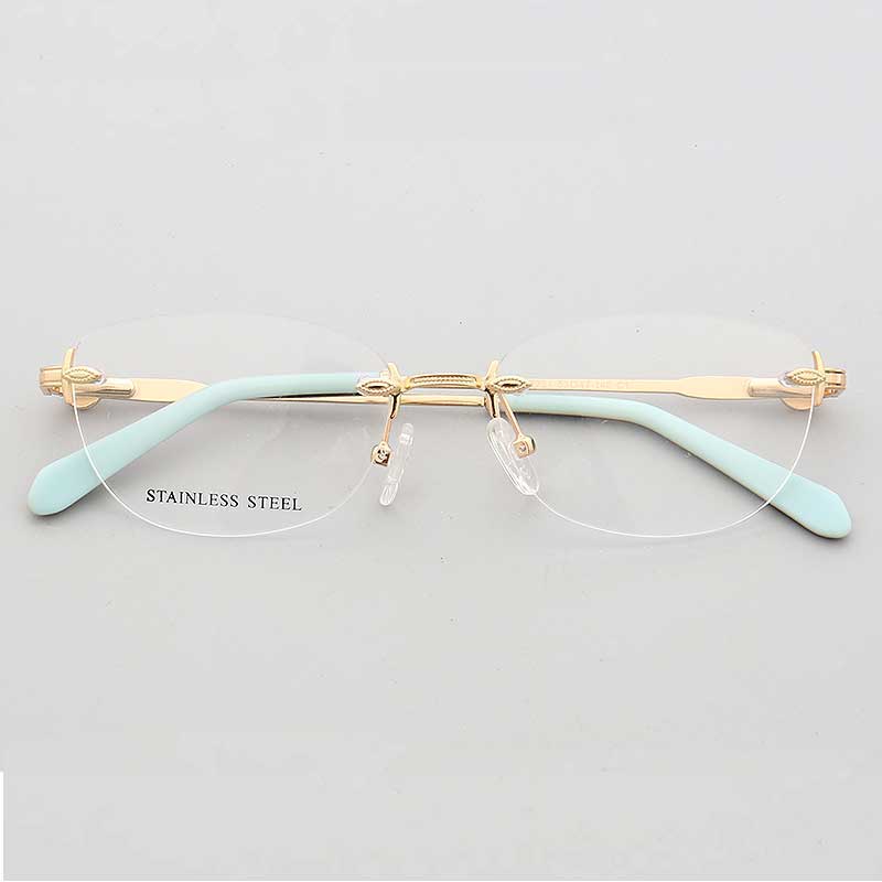 Gold and teal oval rimless eyeglass frames