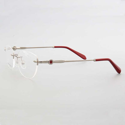 Side view of silver and red rimless oval eyeglasses