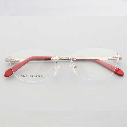 Front view of silver and red oval rimless eyeglass frames