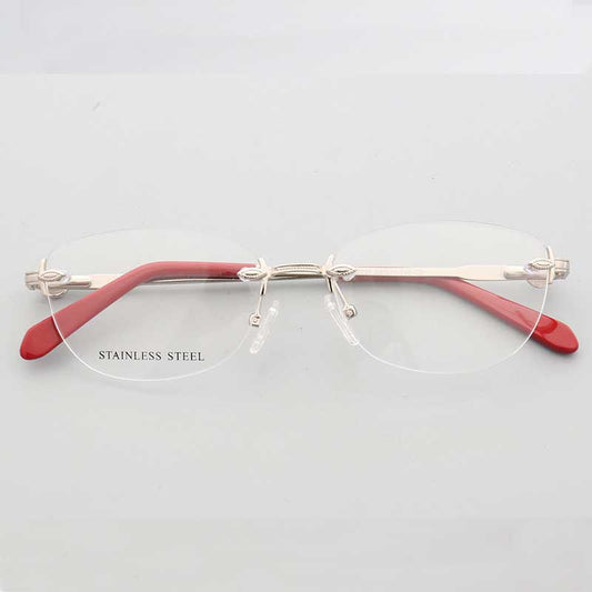 Front view of silver and red oval rimless eyeglass frames