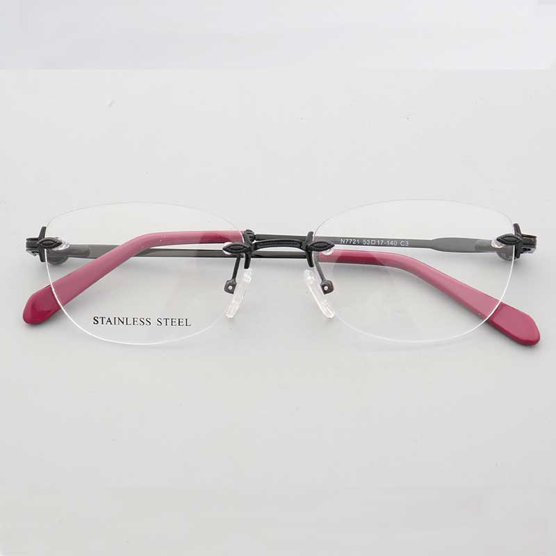 Black and pink oval rimless eyeglass frames