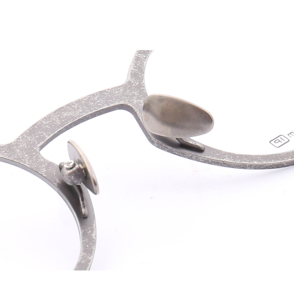 Nose pads of grey titanium eyeglass frames