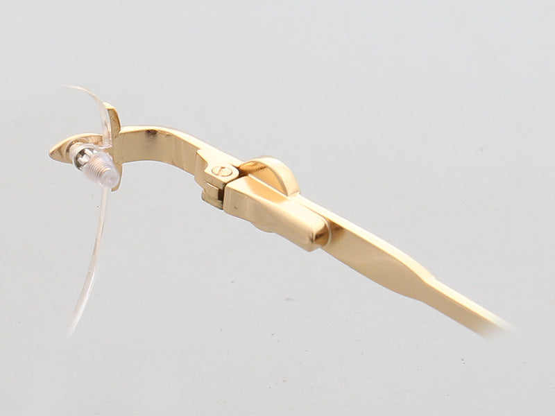 Inner hinge of gold oval rimless eyeglasses