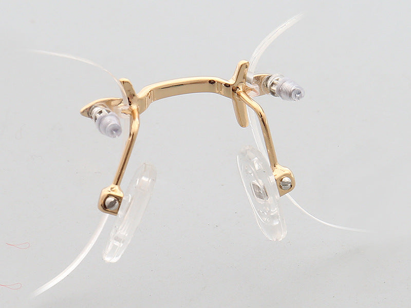 Nose pads of gold oval rimless eyeglass frames