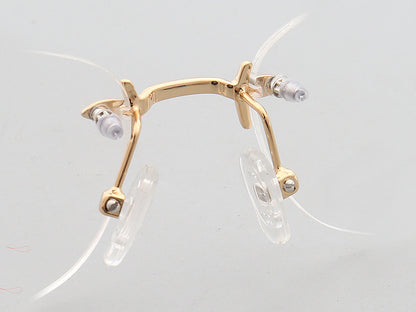 Nose pads of gold oval rimless eyeglass frames