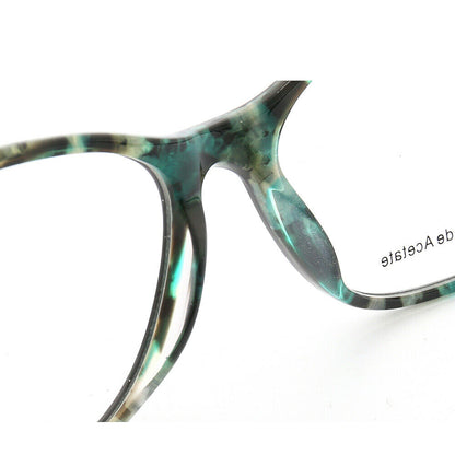 Bridge of aqua colored cat eye glasses 