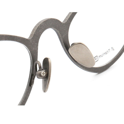 Nose pads of grey butterfly shaped titanium eyeglasses
