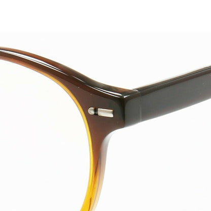Temple of round caramel colored glasses frames